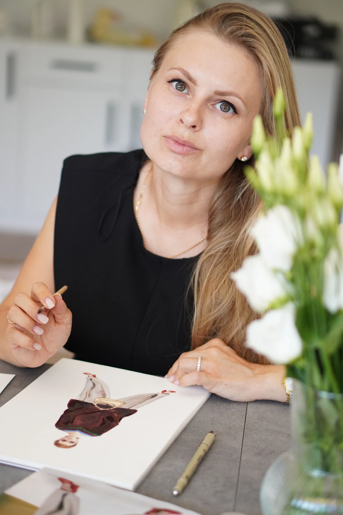 Oksana Hammersmith at her drawing table